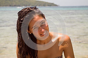 Portrait of a beautiful girl with wet skin from seawater