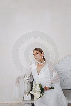 Portrait of a beautiful girl with white flowers.