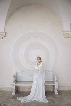 Portrait of a beautiful girl with white flowers.