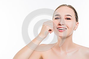 Portrait of a beautiful girl who touches her skin, portrait on a white isolated background