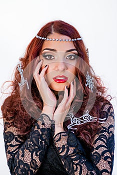 Portrait of beautiful girl with winter decorations in her hair