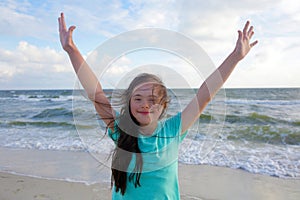 Portrait of the beautiful girll smiling on background of the sea