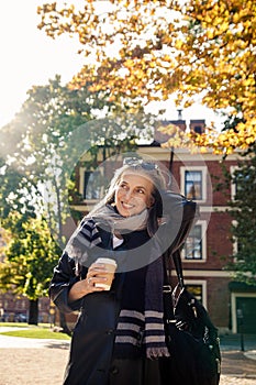 Portrait of  beautiful gray-haired elderly woman in  park
