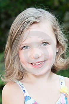 Portrait of a beautiful happy liitle girl close-up