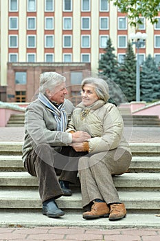 Portrait of beautiful happy mature couple resting together outdoors