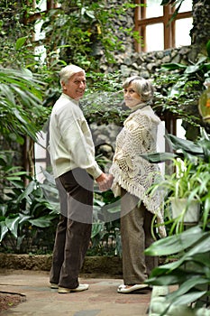 Portrait of beautiful happy mature couple resting together outdoors