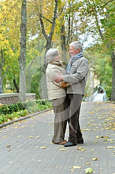 Portrait of beautiful happy mature couple resting together outdoors