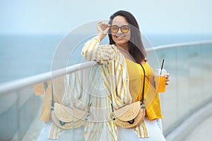 Portrait of beautiful and happy milenniall woman 30-35 years old on vacation enjoy the view