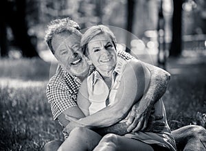 Portrait of a beautiful happy senior couple in love relaxing in the park