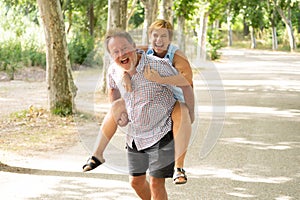 Portrait of a beautiful happy senior couple in love relaxing in the park