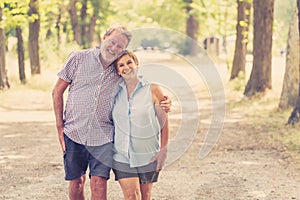 Portrait of a beautiful happy senior couple in love relaxing in the park