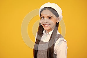 Portrait of beautiful happy smiling teenage girl on yellow studio background. Happy face, positive and smiling emotions