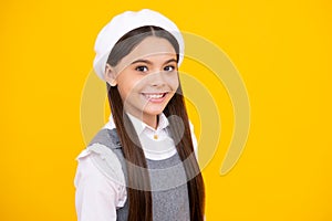 Portrait of beautiful happy smiling teenage girl on yellow studio background. Happy face, positive and smiling emotions