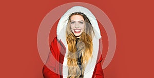 Portrait of a beautiful happy smiling woman celebrate winter Christmas holidays  on red background. Young