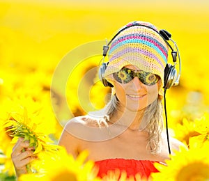 Portrait of beautiful happy woman listening to mus