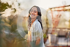 Portrait of beautiful happy woman smiling during sunset outdoor