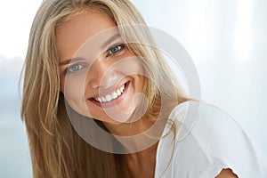 Portrait Beautiful Happy Woman With White Teeth Smiling. Beauty photo