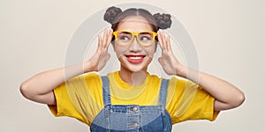 Portrait of the beautiful happy young woman in glasses isolated on white background