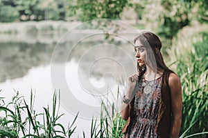 Beautiful hippie girl on spring forest background