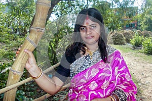 Portrait of the beautiful Indian housewife wearing a pink saree