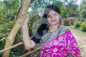 Portrait of the beautiful Indian housewife wearing a pink saree