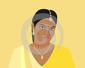 Portrait of beautiful indian woman. A young Hindu girl in traditional clothes and with golden jewelry. Woman in yellow sari and