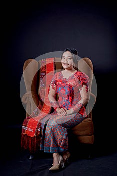 Portrait of beautiful indonesian women wearing traditional batak costume