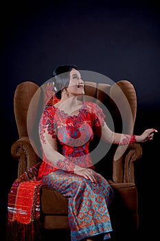 Portrait of beautiful indonesian women wearing traditional batak costume