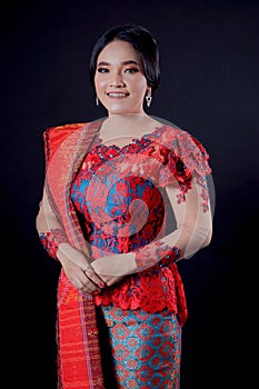 Portrait of beautiful indonesian women wearing traditional batak costume