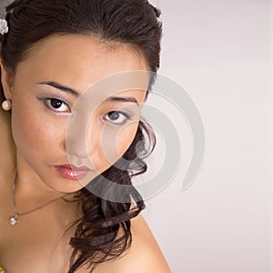 Portrait of beautiful kazakh woman looking at camera isolated on whiteâ€“ stock image