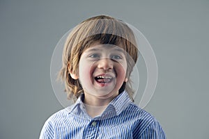 Portrait of a beautiful kid laughing isolated