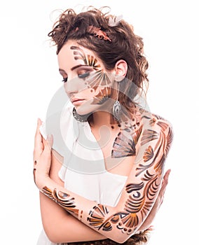 Portrait of beautiful lady with bodyart