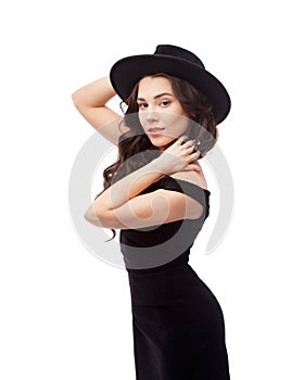 Portrait of a beautiful lady wearing a black hat and evening dress