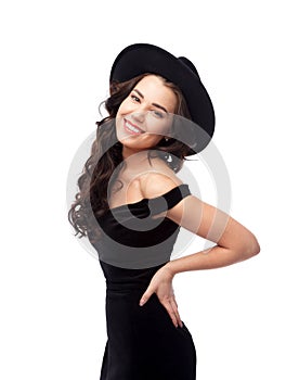 Portrait of a beautiful lady wearing a black hat and evening dress