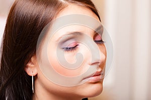 Portrait beautiful latin woman with closing eyes pink eyeshadows