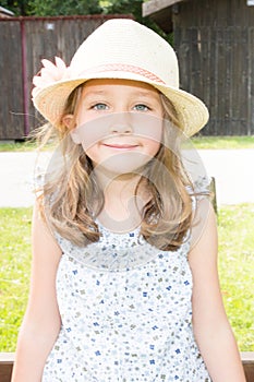 Portrait of a beautiful liitle girl with hat