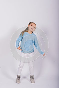 Portrait of beautiful little girl happy smiling on studio. Isolated white background