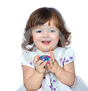 portrait of a beautiful little girl holding Easter eggs on a white background