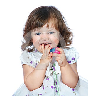 portrait of a beautiful little girl holding Easter eggs on a white background