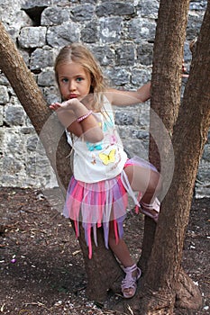 Portrait of a beautiful little girl in mini skirt