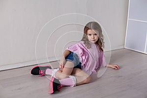 Portrait of a beautiful little girl in a pink dress five years