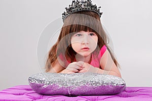 Portrait of beautiful little girl in pink Princess dress with cr