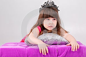 Portrait of beautiful little girl in pink Princess dress with cr