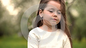 Portrait beautiful little girl smiling looking happy cute child having fun in sunny park outdoors