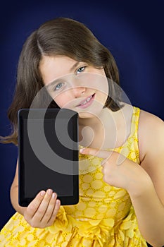 Portrait of beautiful little girl with tablet