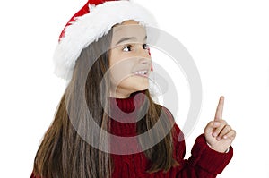 Portrait of beautiful little girl wearing Santa Claus hat.