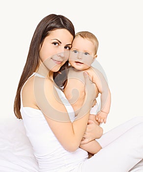 Portrait beautiful loving mom and cute baby on hands