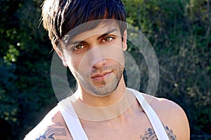 Portrait of a beautiful man with bangs photo