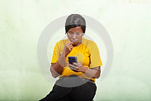 portrait of a beautiful mature woman looking at mobile phone