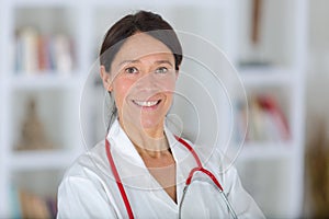 Portrait beautiful middle aged female doctor smiling